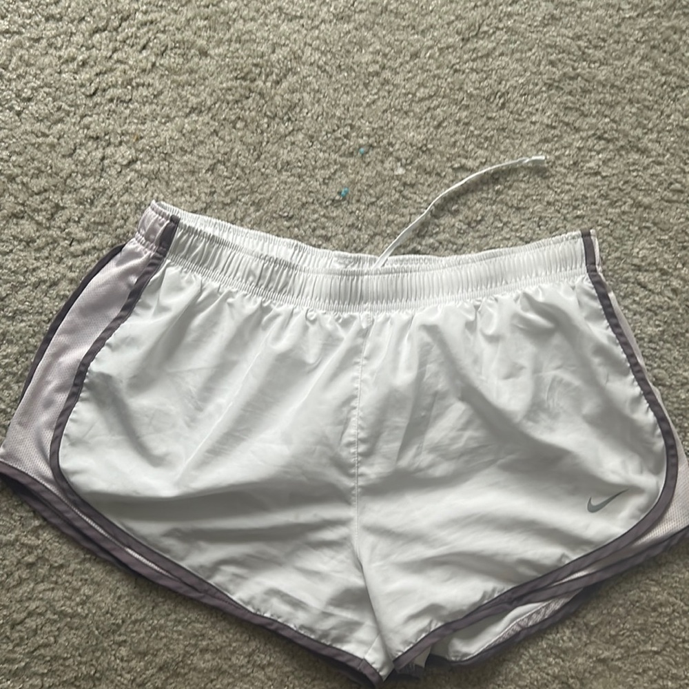 White Nike Shorts with Purple Accents. Slightly Worn. Very comfortable.